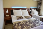 Кровать или кровати в номере Kandelor Hotel