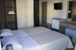 Кровать или кровати в номере Titania Hotel