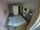 Кровать или кровати в номере Titania Hotel