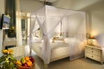 Кровать или кровати в номере Portes Beach Hotel