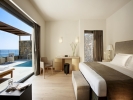 Кровать или кровати в номере Daios Cove Luxury Resort & Villas