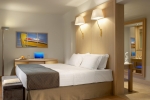 Кровать или кровати в номере Daios Cove Luxury Resort & Villas