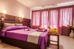 Кровать или кровати в номере Porto Daliani