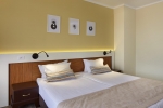 Кровать или кровати в номере Hotel Nobel