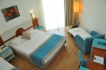 Кровать или кровати в номере Zena Resort Hotel