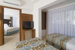 Кровать или кровати в номере Palm Wings Kusadasi Beach Resort&Spa