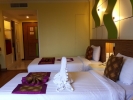 Кровать или кровати в номере Caesar Palace Hotel