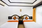 Кровать или кровати в номере Tri Trang Beach Resort