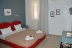 Кровать или кровати в номере Yiannis Apartments 