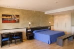 Кровать или кровати в номере Hotel Samba