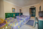 Кровать или кровати в номере Palm Beach Resort Families and Couples Only