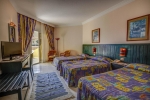 Кровать или кровати в номере Palm Beach Resort Families and Couples Only