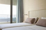Кровать или кровати в номере Capo Bay Hotel