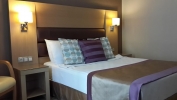 Кровать или кровати в номере Sesin Hotel
