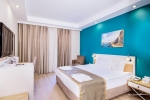 Кровать или кровати в номере Crystal Green Bay Resort & Spa