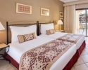 Кровать или кровати в номере Jaz Makadi Saraya Resort