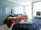 Кровать или кровати в номере Occidental Cala Viñas