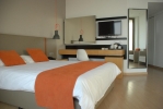 Кровать или кровати в номере Crystal Springs Beach Hotel