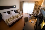 Кровать или кровати в номере Domina Sultan Hotel & Resort
