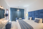 Кровать или кровати в номере Odessa Beach Hotel