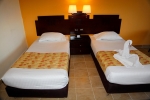 Кровать или кровати в номере Coral Sun Beach