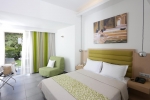 Кровать или кровати в номере Bali Star Hotel
