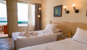Кровать или кровати в номере Coral Beach Resort Tiran (Ex. Rotana)