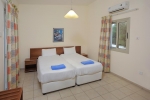 Кровать или кровати в номере Nissiana Hotel & Bungalows